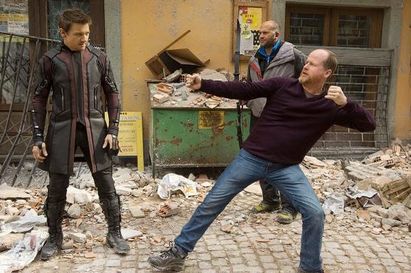 Joss Whedon give Jeremy Renner archery tips, on the set of Ultron (image: © Marvel Studios).